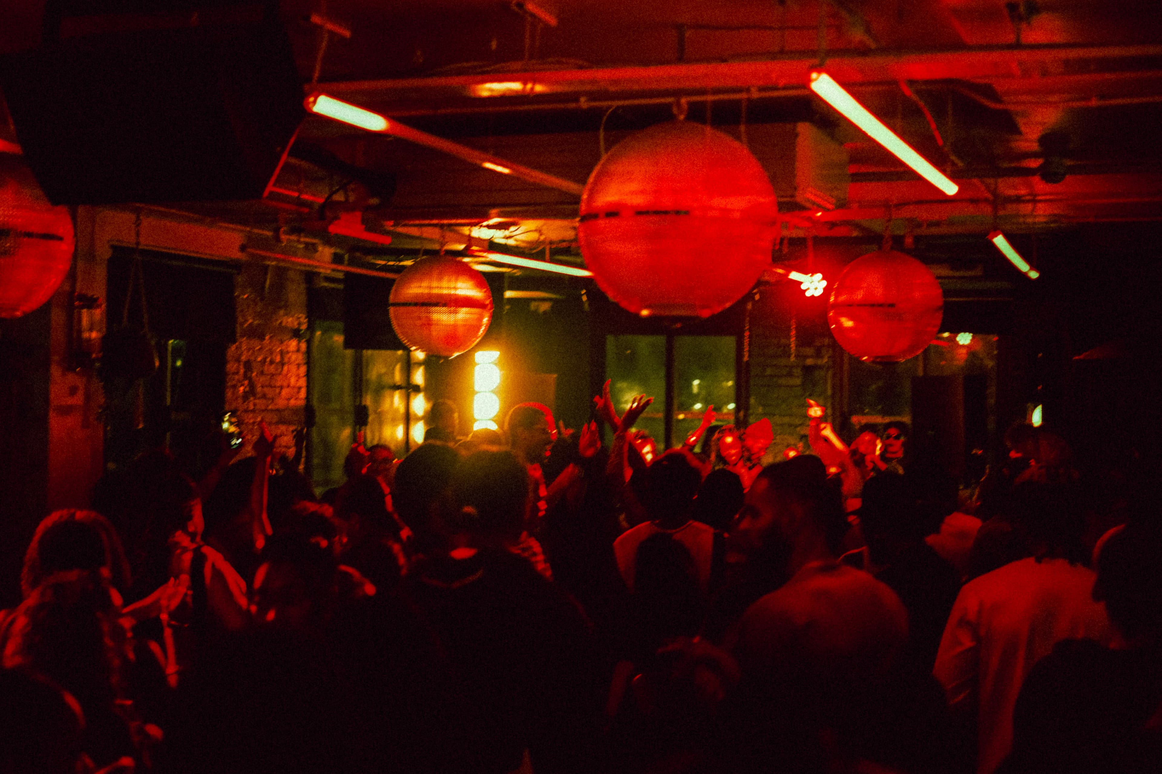 Dancers under projection mapping at a tunnel venue